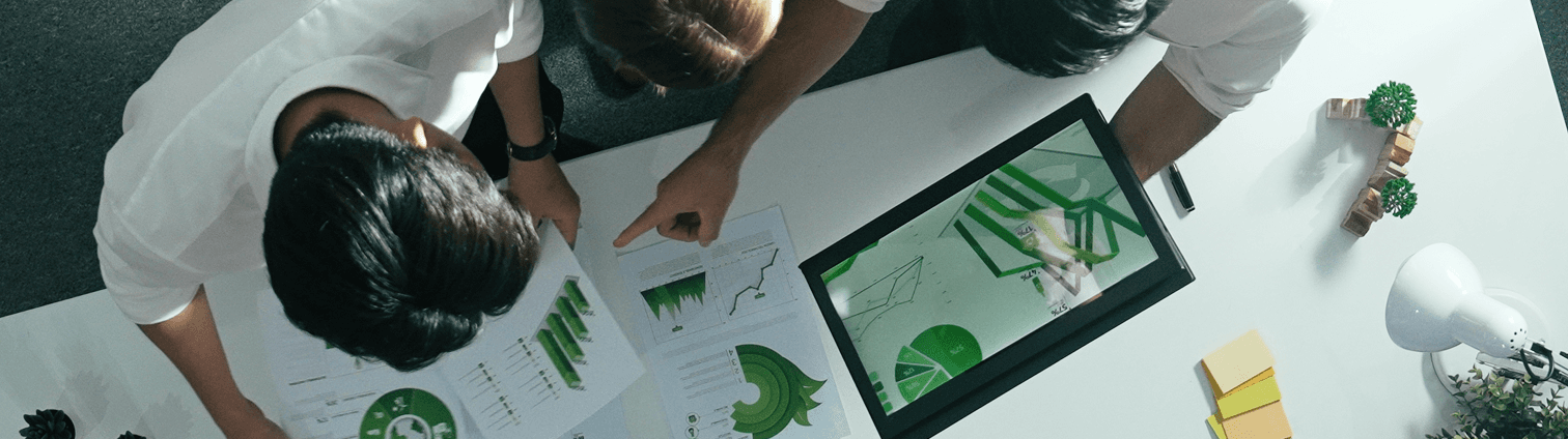 Person pointing to green graph