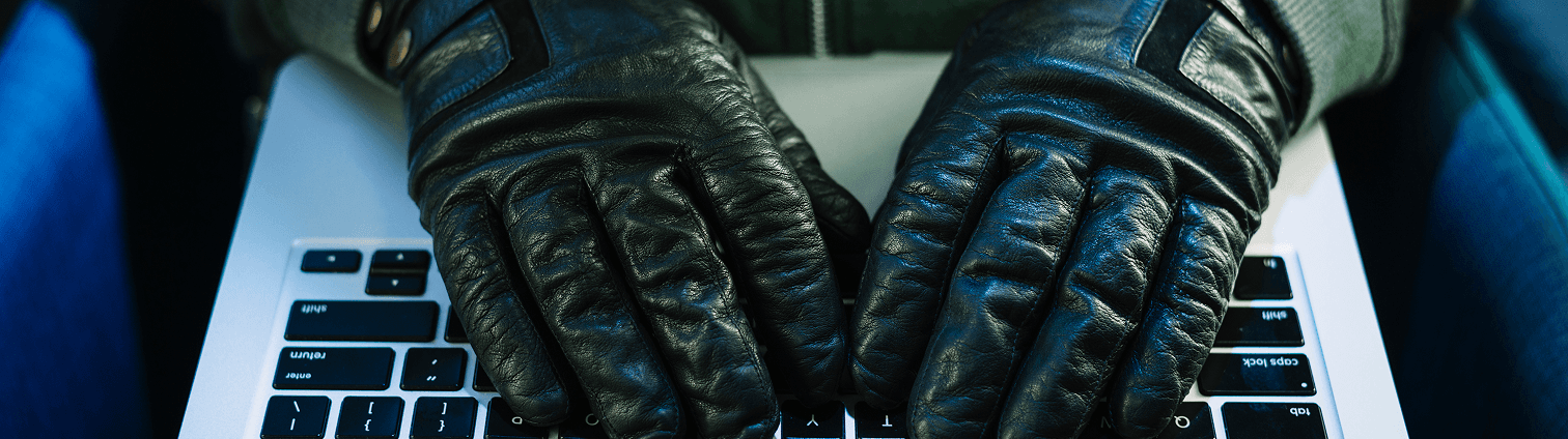 Gloved person typing